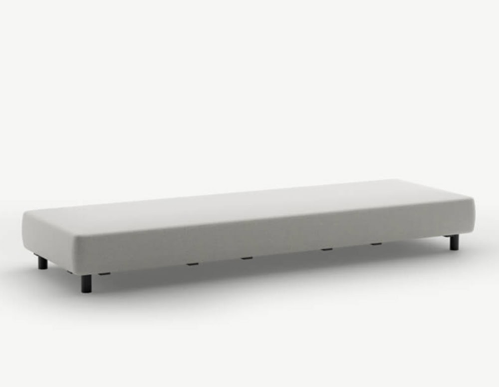 A light grey outdoor bench-style sofa module with a long rectangular form, supported by low black cylindrical legs for a sleek minimalist profile.