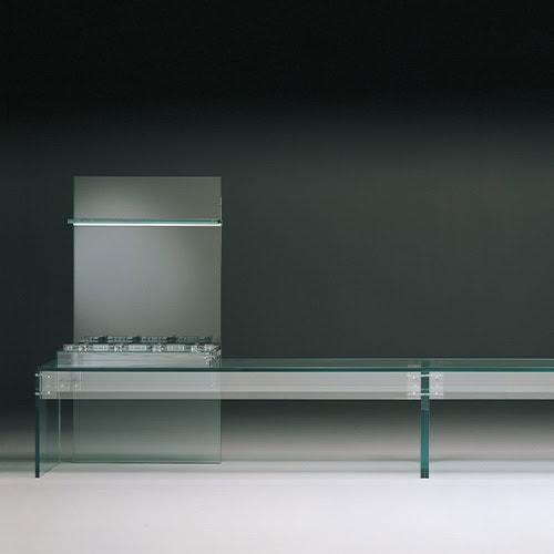 Simplicity Kitchen showcases a minimalist design with sleek glass surfaces and clean lines, offering modern elegance and functional storage
