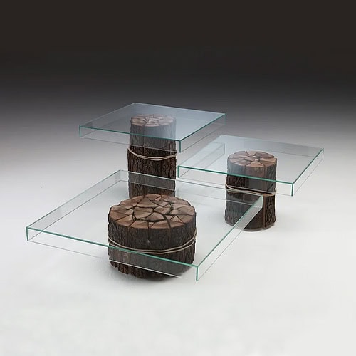 Simplicity Three Tables featuring a modern glass design with cylindrical upholstered stools for a stylish and functional touch
