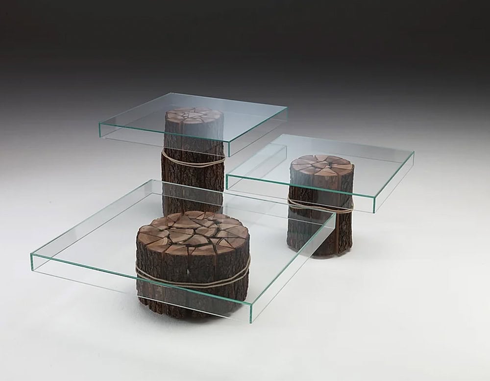Simplicity Three Tables featuring transparent glass surfaces supported by cylindrical wooden bases