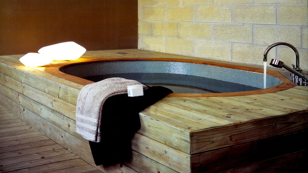 lamp made of stones of different sizes made of glass in a yellow tone