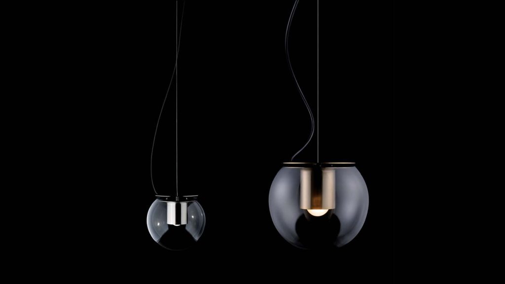 Available in table, suspension, and wall lamp versions.