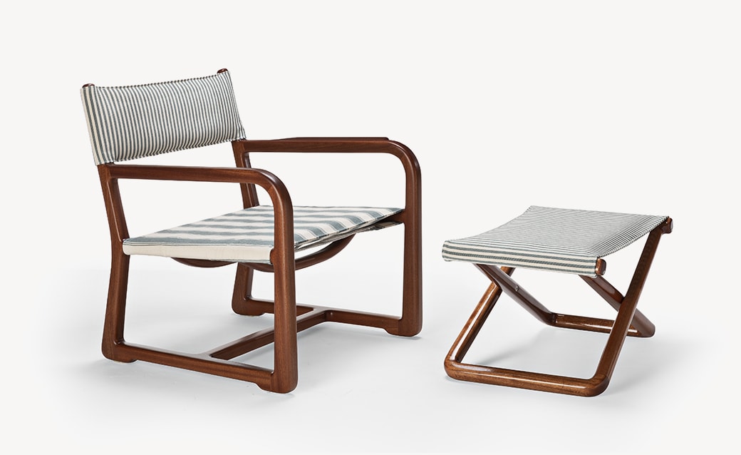 Loro Piana armchair and matching ottoman with a wooden frame and light gray fabric upholstery