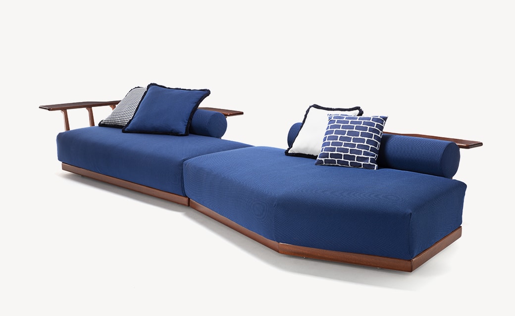 Sunset Platform modular sofa with deep blue cushions, a wooden base, and integrated side tables