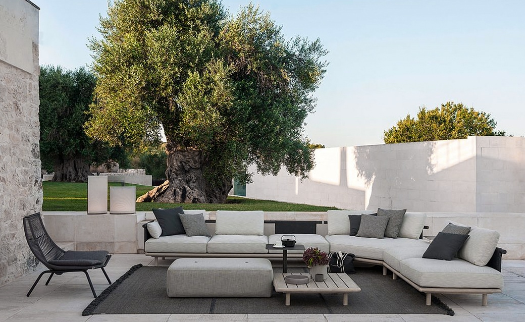 Eden outdoor sectional sofa with plush cushions in a modern patio setting