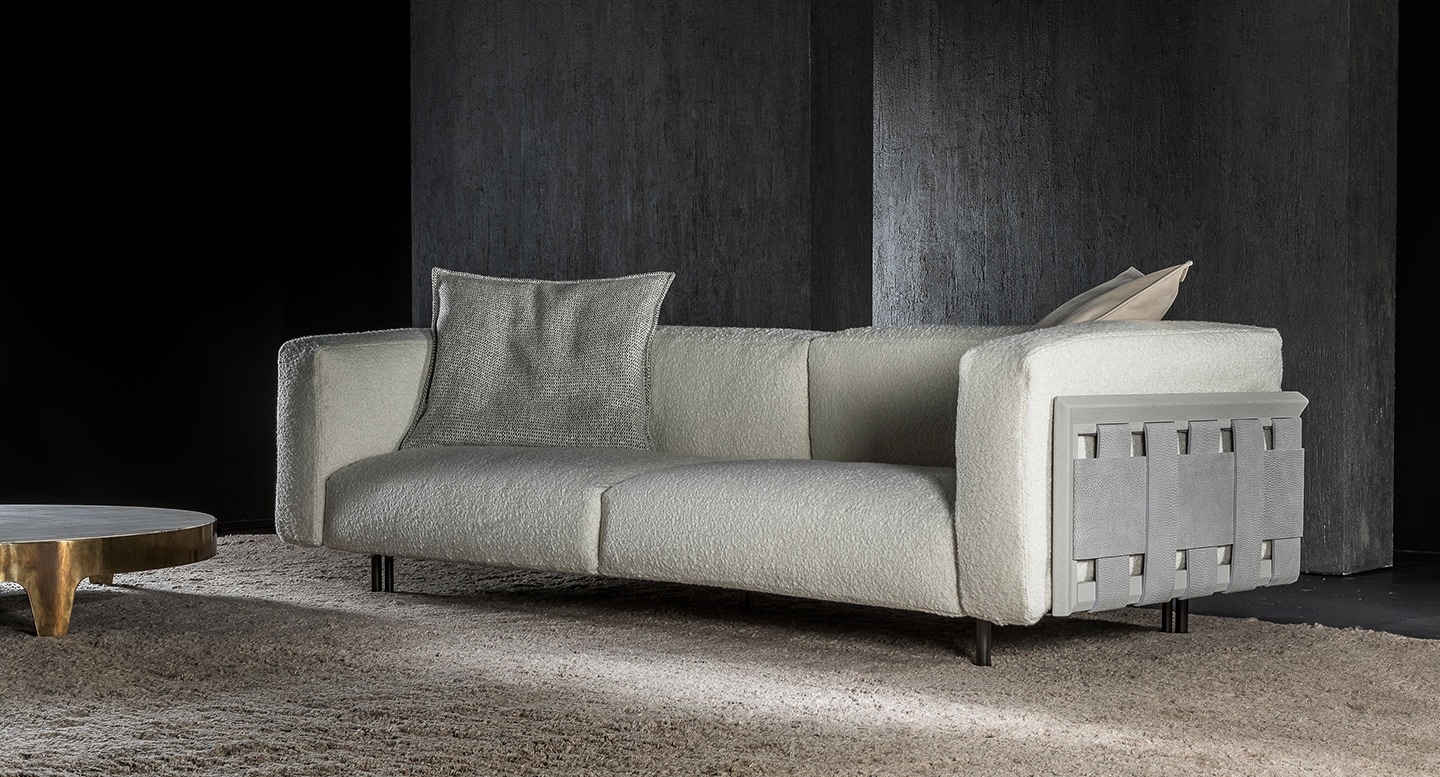 Henge RF Sofa featuring a contemporary design with plush upholstery, a sturdy frame, and distinctive side panel details