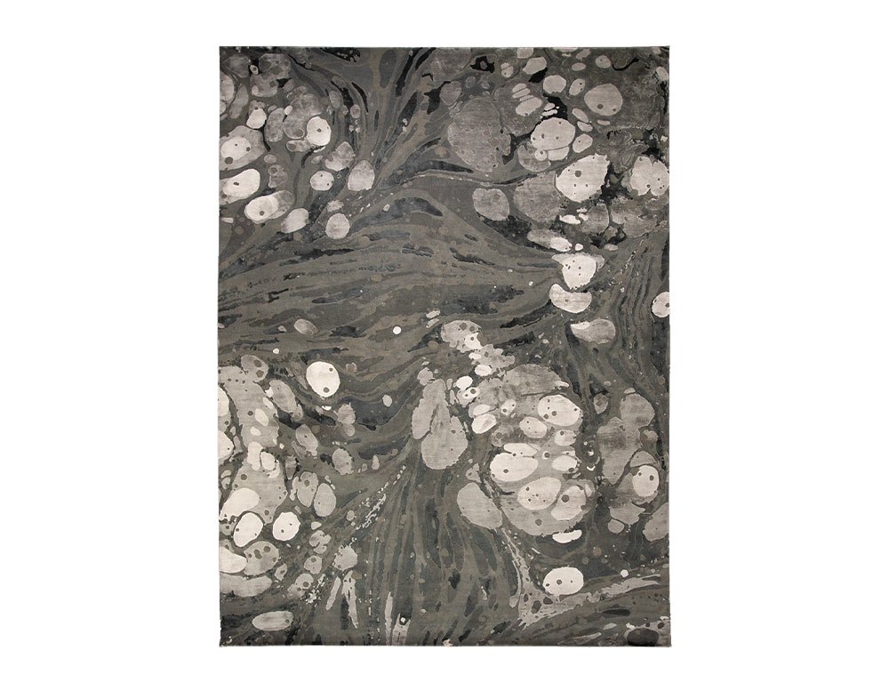 alfombra con tonalidades de gris y blanco hecha con New Zealand Wool and natural silk relief