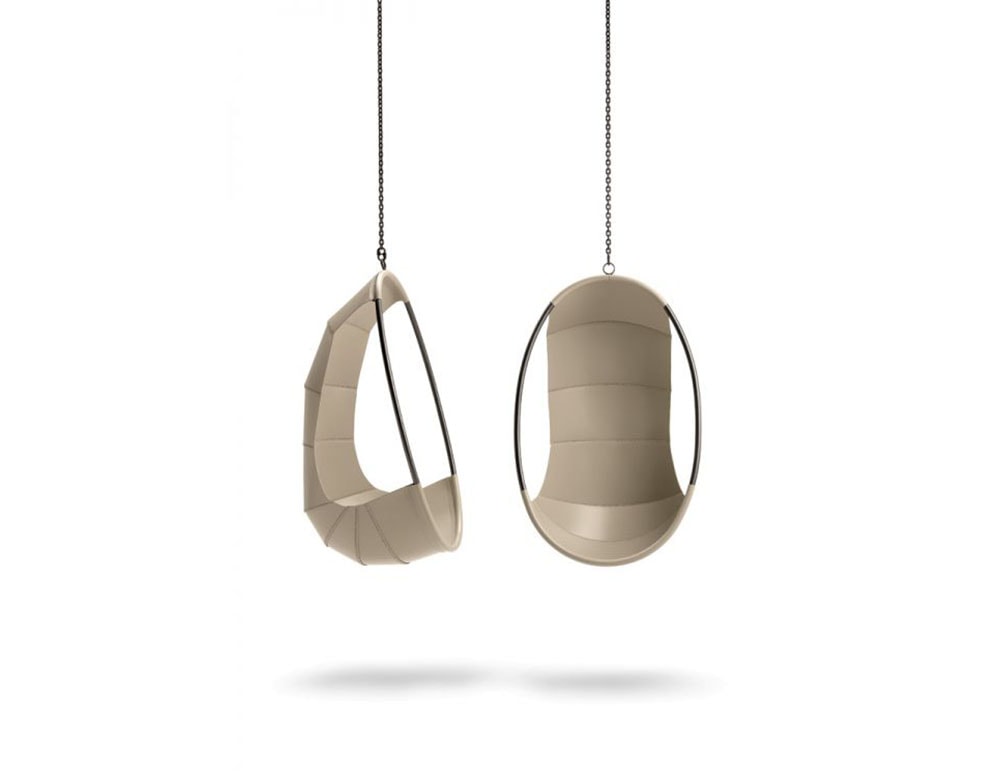 Hanging egg-shaped armchair made of cuddly and full-grain leather in a beige tone on a white background