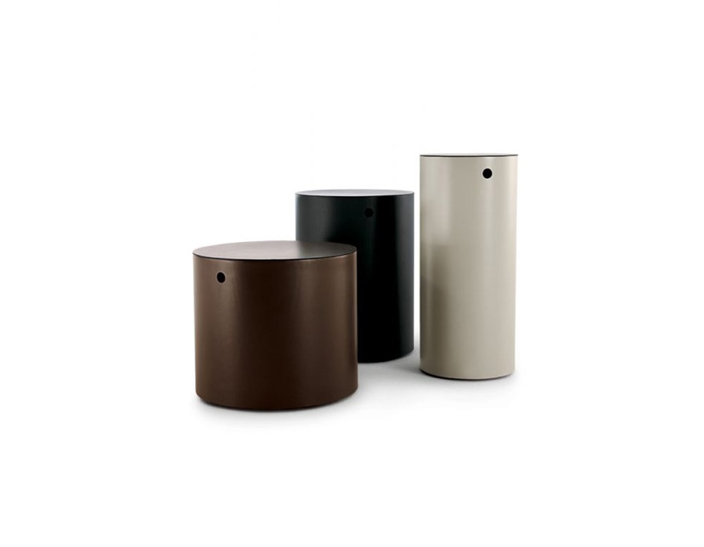 cylinder-shaped nightstands made of brass or full-grain leather in color tones such as white, black and brown on a white background