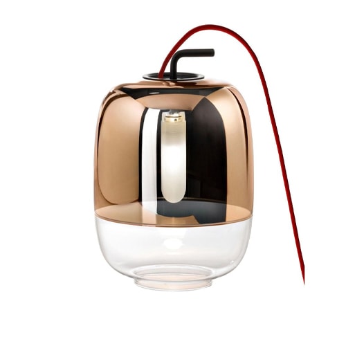 Elegant copper table lamp featuring a clear glass bottom for a modern touch.