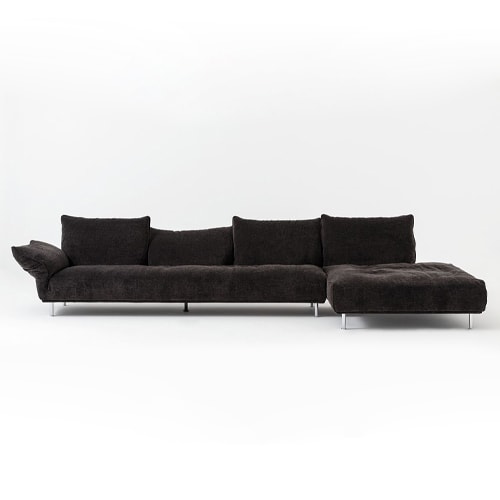 sofa made of soft fabric in a black tone with base on metal legs