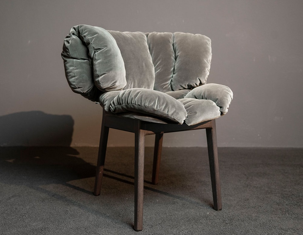 chairs made of black wood and upholstered in gray velvet