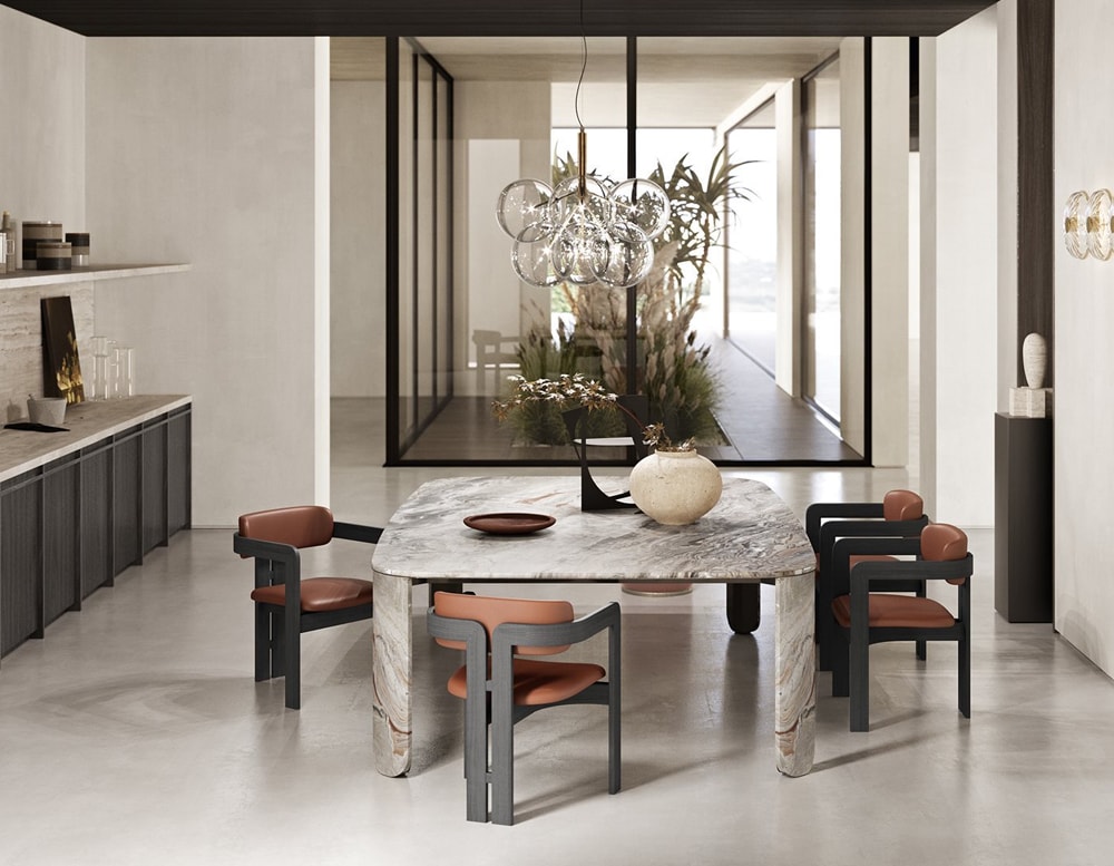 Clemo table with quad chairs surrounding the table with a glass window in the background