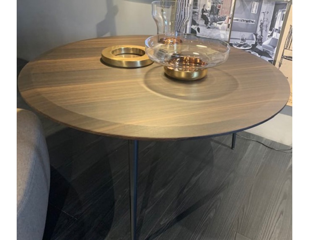 Elevate your dining area with the elegance of this circular eucalyptus table.