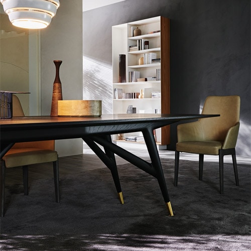 Elevate your dining space with this sleek black stained ash wood dining table.