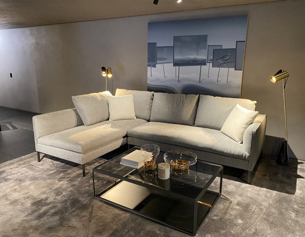 Create a cozy and inviting atmosphere with this elegant L-shaped sectional.