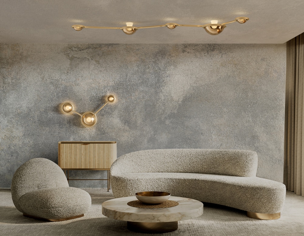 ceiling lamp in the shape of planetary spheres joined by a metal base in gold and white tone in a room