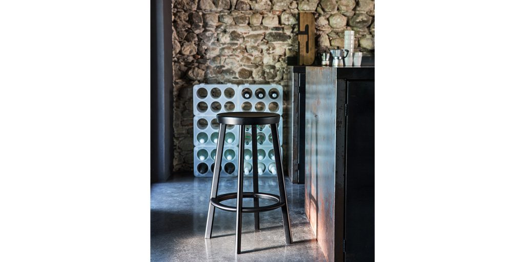 stool made of black aluminum in its entire structure in a bar room