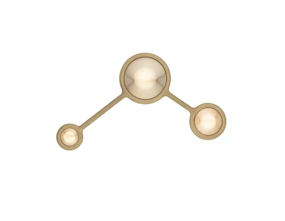 ceiling lamp made of metal by hand in the shape of three connected spheres in a gold and white tone for its LED lighting in a white background