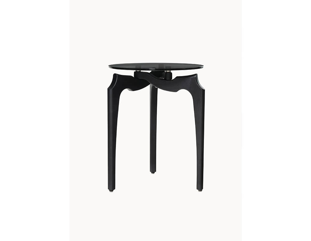 side table made of wood and glass top with a circular shape in black tone