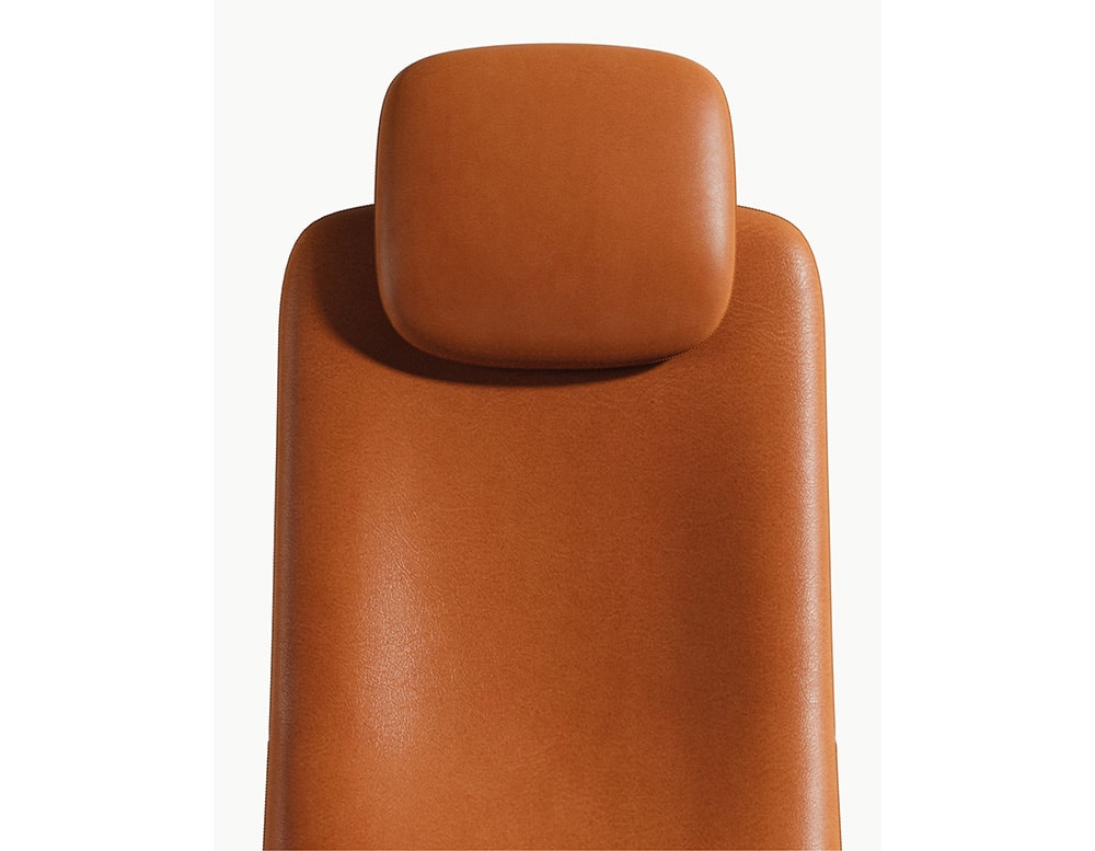 armchair made with orange leather in its upper part on a white background