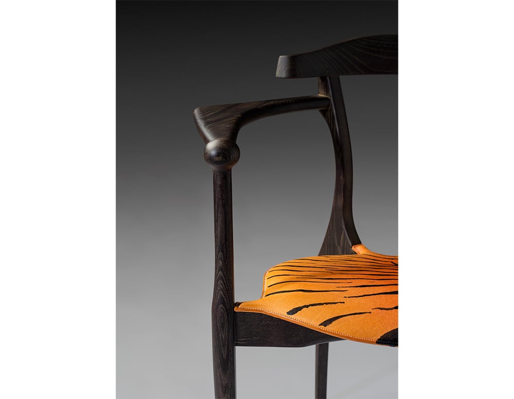 chair with dark brown wooden frame on a gray background