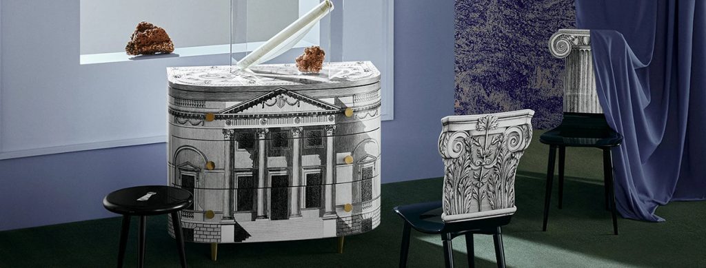 A luxury cabinet with neoclassical architectural prints, styled with artistic elements and a contrasting dark chair in a bold, modern space