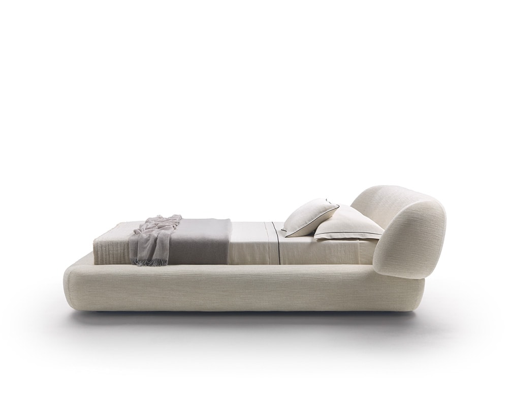 bed made of wood, polyurethane foam and removable leather in different light tones