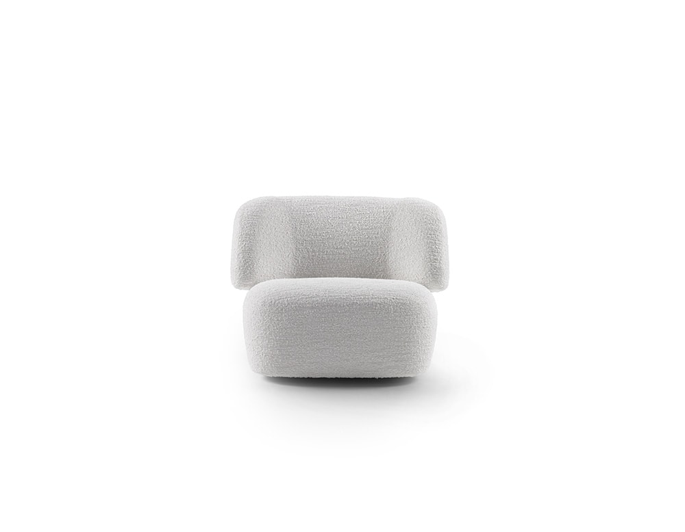 Armchair made of polyurethane foam, wood and white metal base in a white background