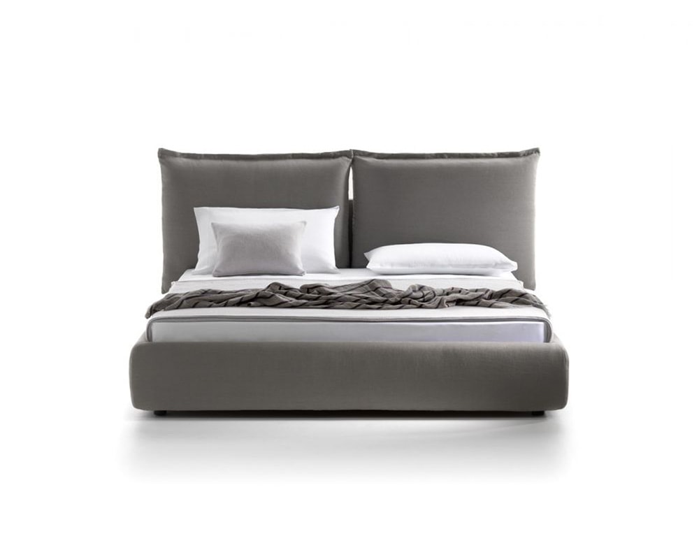 bed with headboard divided into two large cushions made of fabric and wood in a dark gray tone in a white background