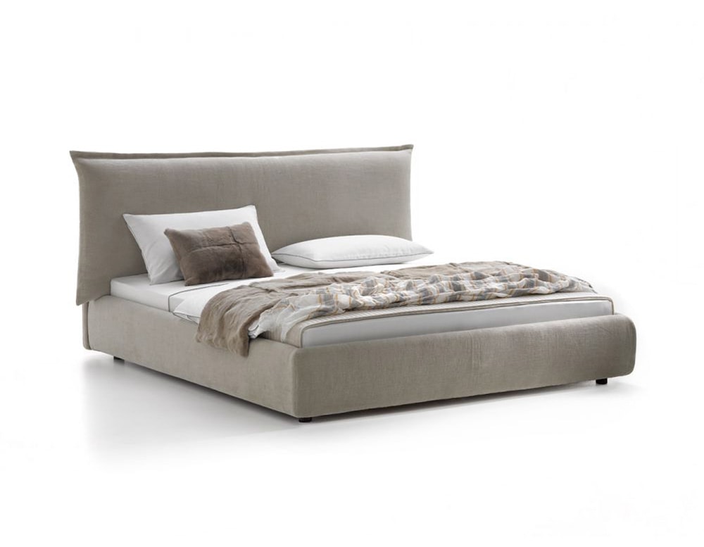 bed with high cushion backrest and wooden base all upholstered in beige fabric on a white background