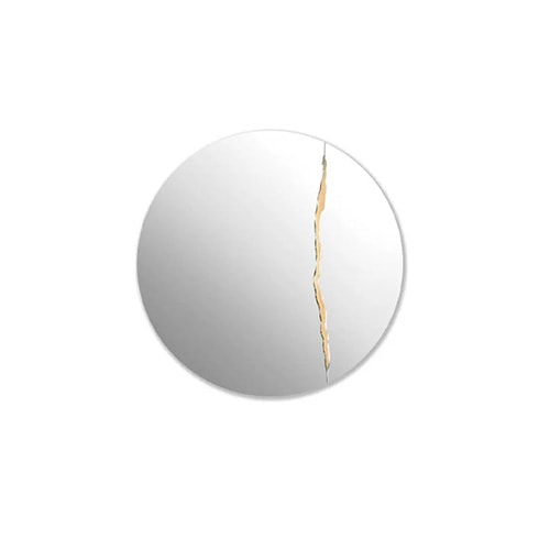 circular mirror made of clear glass with a gold brass finish decoration on a white background