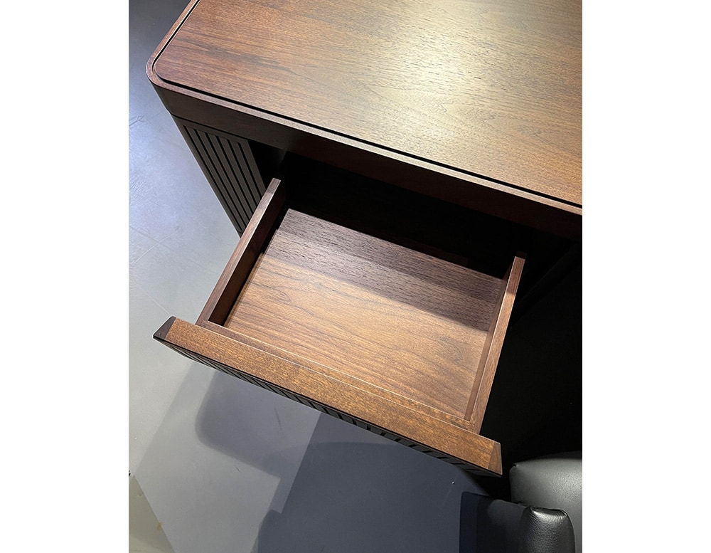 desk made of brown wood, with lacquered pressure drawers