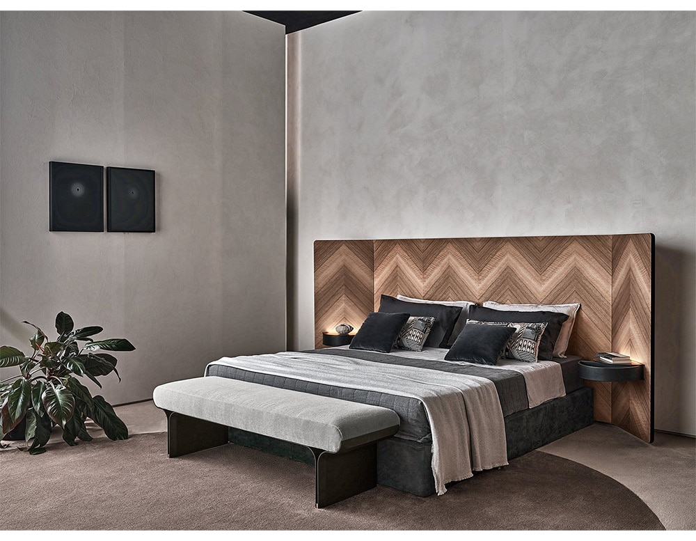 bed with embedded and adjustable backrest made of wood in different shades of coffee in a room