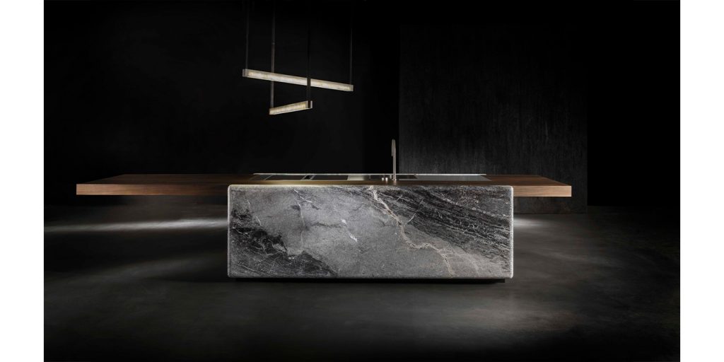 kitchen counter made of dark brown wood, white stone and metal