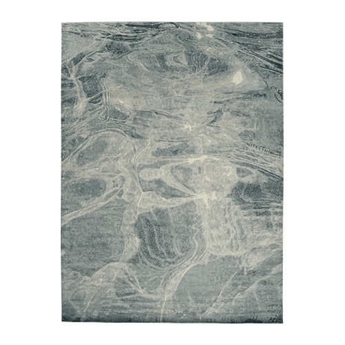 rug made of fabric with finishes simulating sea waves in a bluish tone in different intensities