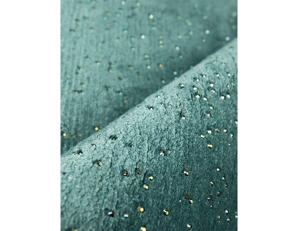 rug made of blue fabric and wool with water drop finishes
