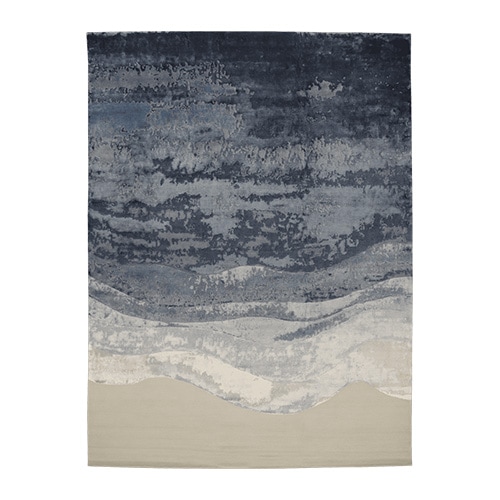 rug made of wool and hand-knotted in a shade of blue with white