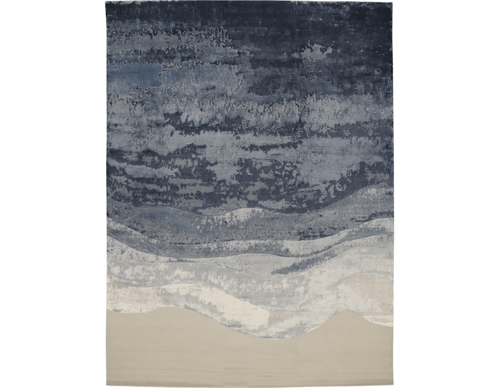 rug made of wool and hand-knotted in a shade of blue with white in a white bakcground