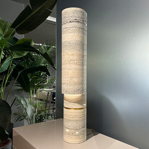 Sculptural stone table lamp with hollowed monolithic diffuser element