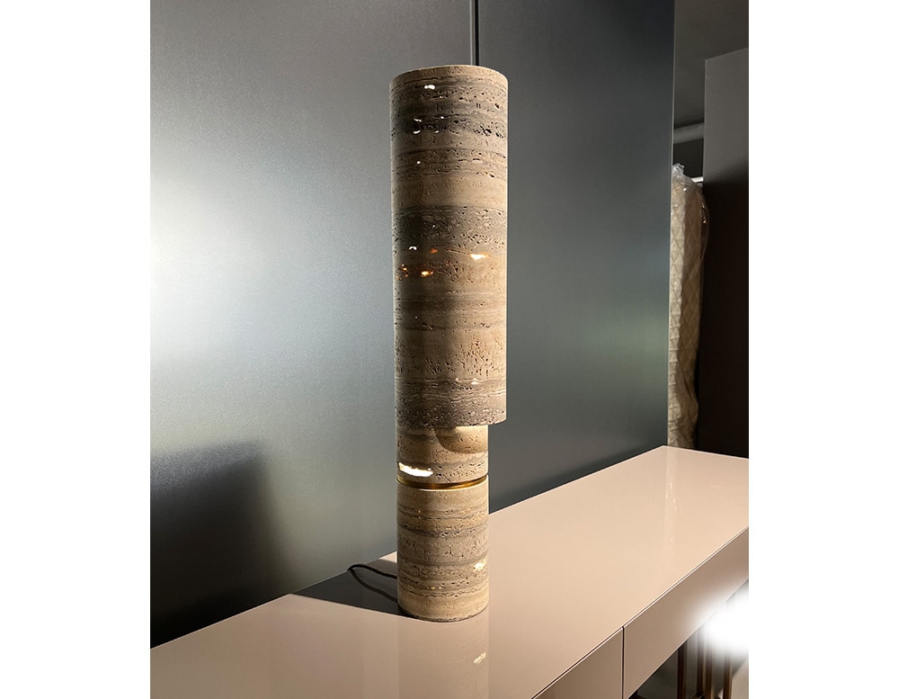 table lamp made of light stone and golden brass in a living room