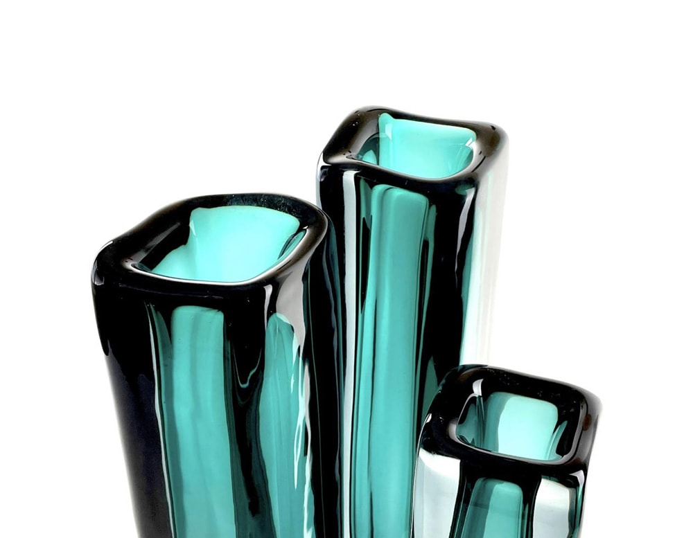long square glass sculptures with a square-shaped opening at the top