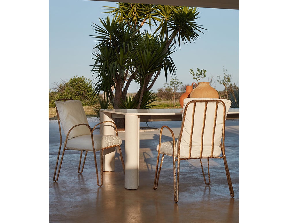 Outdoor chair made with a base made of gold aluminum and upholstered in white and finished in a patio