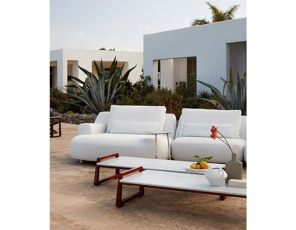 Outdoor sofas made with polyurethane foam and upholstered with white fabric.