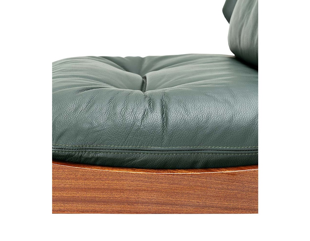 removable chairs upholstered with dark green leather on their padding.