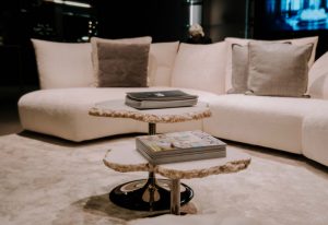 A striking coffee table that blends organic and modern elements, featuring sculptural branches as its base with elegant stone tabletops