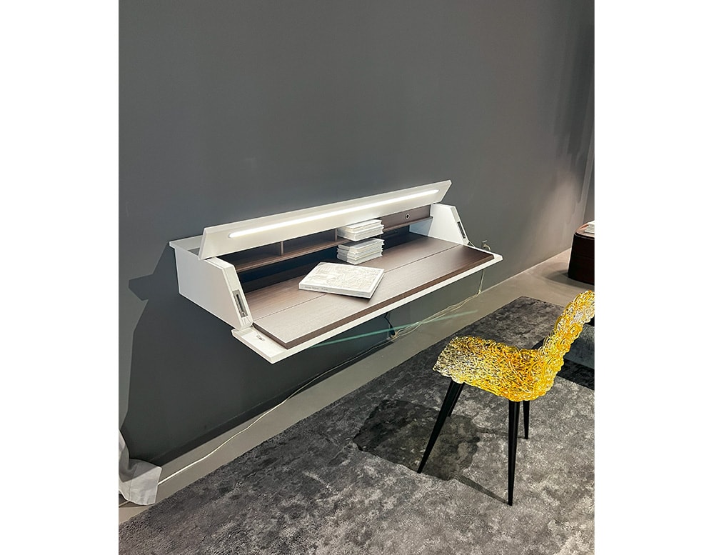 Writing-desk with a brown wood front panel turning into a handy writing table with a built-in desk light and a white matte color lacquered door and top