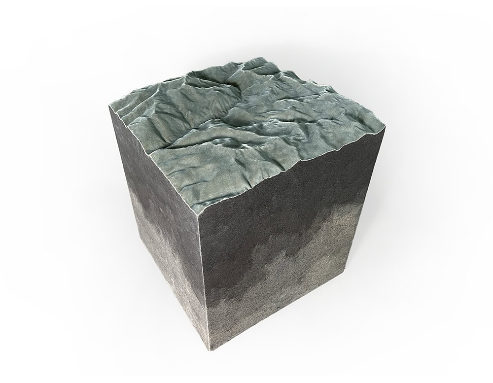 The Horizons Pouf is a sculptural seat inspired by natural landscapes, crafted with a textured surface that mimics geological layers. Its bold cubic form combines design and art, making it a unique accent for modern interiors.