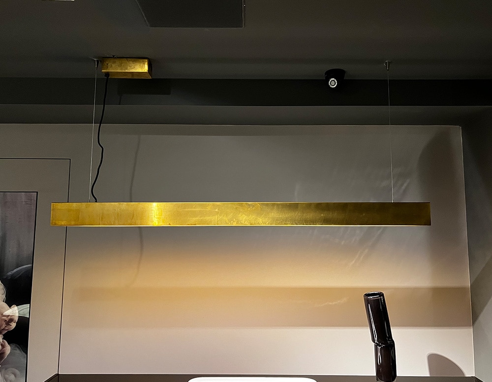 LED suspension lamp made with a golden antiqued satin brass structure