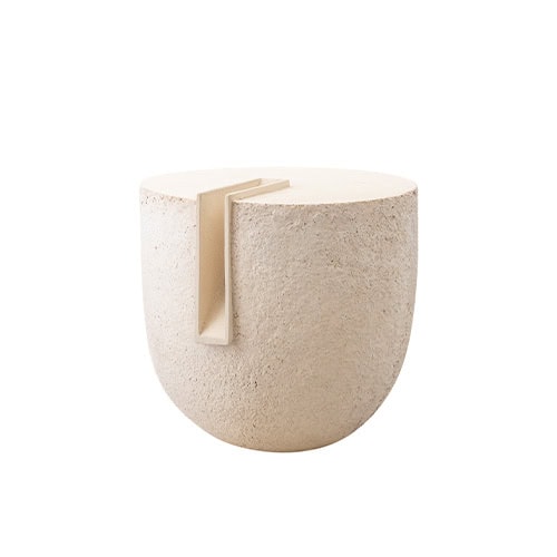 Natural stone accessory with a rough textured surface and a clean geometric cut on top. Its sculptural form blends organic materiality with modern minimalism, making it a striking decorative accent.